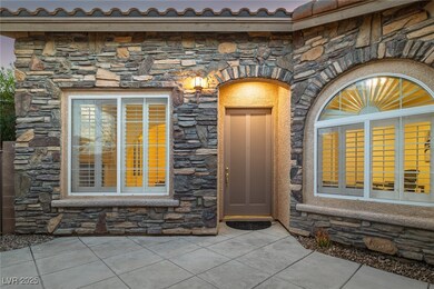 Property entrance featuring stone siding