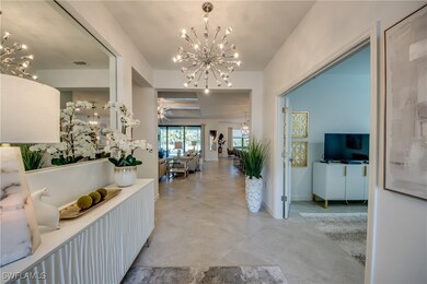 Entrance foyer with ceiling fan with notable chand