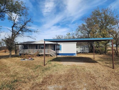 View of front facade featuring a storage shed and 