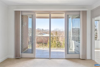 Light filled living room opens out onto covered ba