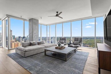 Living room featuring expansive windows, a ceilin