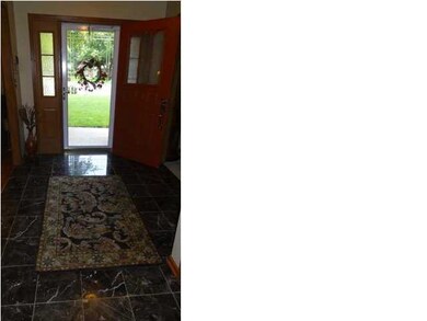 The entry hall has been recently updated with marb