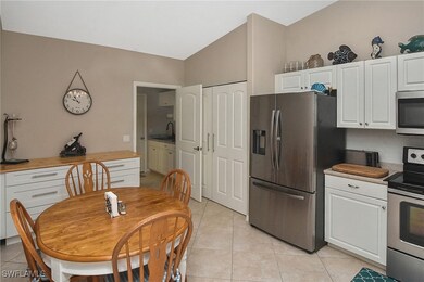 Kitchen featuring wood counters, appliances with s