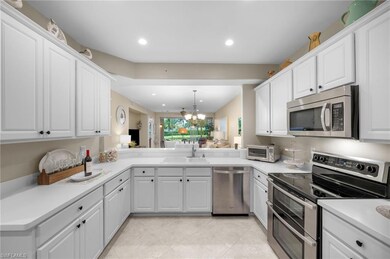 Kitchen featuring kitchen peninsula, stainless ste