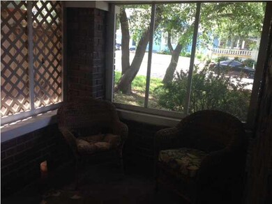 Living room is attached to this sunroom.