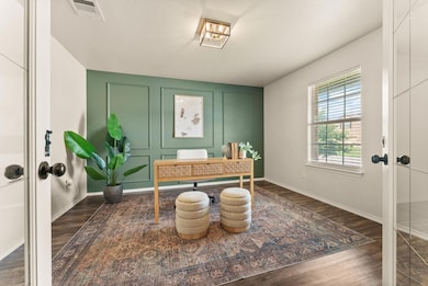 Office featuring wood finished floors and baseboa
