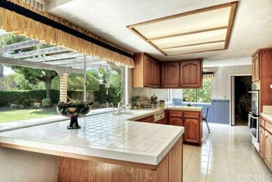 Large Kitchen with Tile Floor, Tile Countertops, B