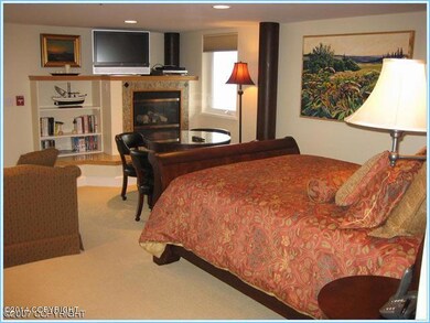 Bedroom-sitting area in lower unit