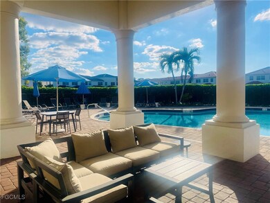 Community pool featuring a patio area and outdoor lounge area