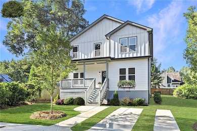 View of front of house with a porch, board and batten siding, and stairs