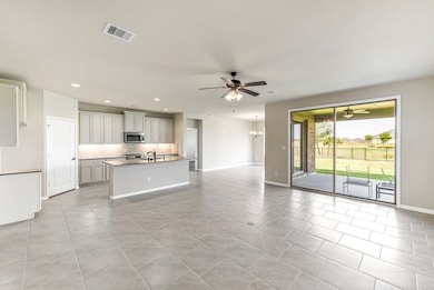 Family room, kitchen and dining area is designed with an open concept floor plan and is great for entertaining.