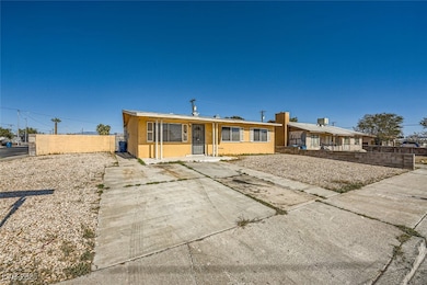 View of front of property with fence and stucco si