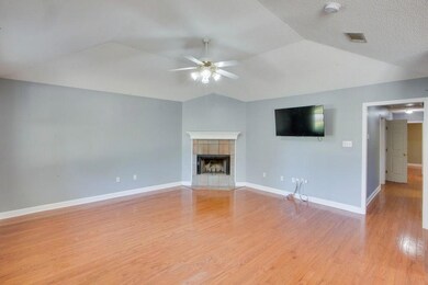 In addition to the fireplace is a large screen tv