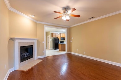 Living room with fireplace with a view to the kitc