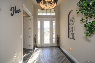 Bright and welcoming entry foyer. Office is thru t