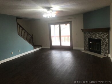 Living area and the stairwell two two bedrooms & b