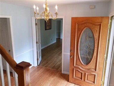 Foyer with brass chandlier