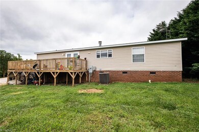 Rear view of home with private back deck.