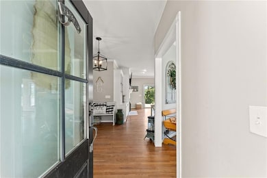 Hallway featuring wood finished floors