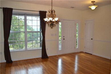 Polished hardwoods line the floors of the Front Entry & Dining Room & continue into the Kitchen & hallway.  The open Dining Rm boasts a beautiful chandelier, chair rail, & large dbl window that takes advantage of the mountainous views all around.