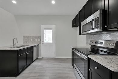 Great kitchen with granite and stainless appliance