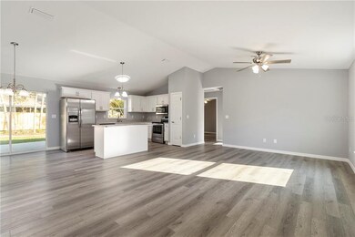 Open floorplan ~ spacious great room!  Vaulted ceilings.  Luxury vinyl plank flooring throughout.