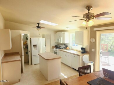 Open concept kitchen with skylight