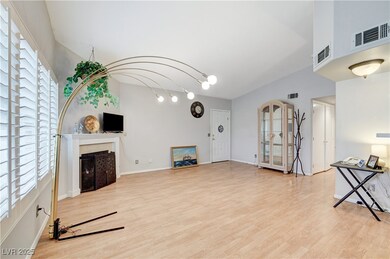 Unfurnished living room with a fireplace, light wo