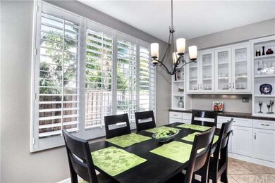 View from breakfast bar into dining area with plan