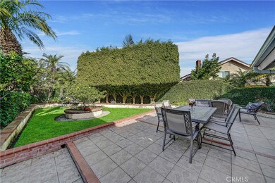 Extra Large Gated Front Couryard Entry with Lawn, Raised Planters, Patio, and Porch