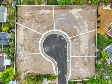 Aerial view of property and surrounding area with property parcel outlined