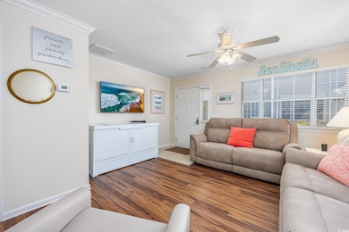 Living room featuring a textured ceiling, wood fin