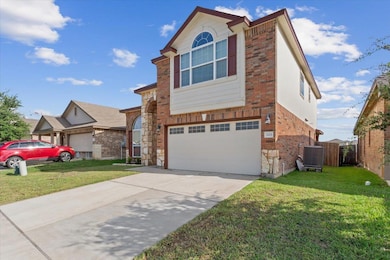 View of front of house with an attached garage, b