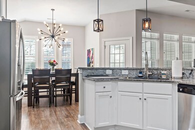 Kitchen featuring stainless steel appliances, whit