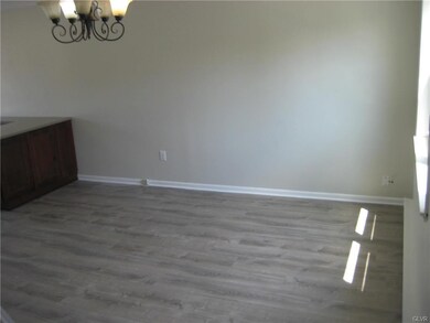 Living room wall with cabinetry into the dining ar