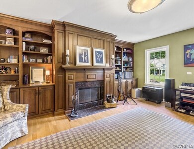 Office off of foyer on rt. w/ wb fireplace