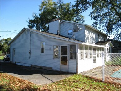 Exterior side view.  Note the additional paved par
