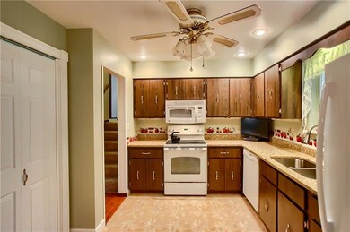 Bright, inviting kitchen with quartz counters and 