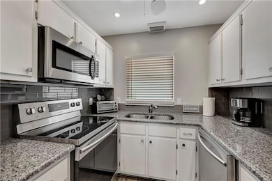 Kitchen featuring appliances with stainless steel 