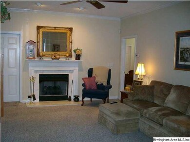 Large Family Room with fireplace and crown molding