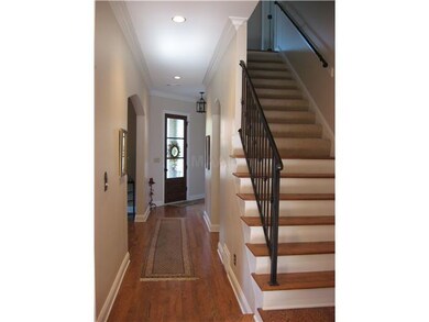 View of front door from hallway, which leads to DR