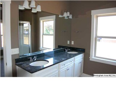 Double vanity with granite countertops.