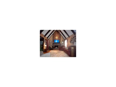 Great room with great space and soaring ceilings.