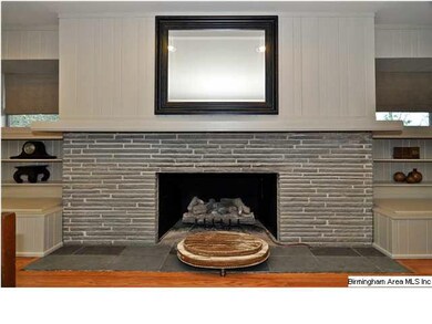Warm up by this gorgeous fireplace with gas logs! 