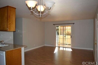 Living Room with Sliding Glass Door to Patio
