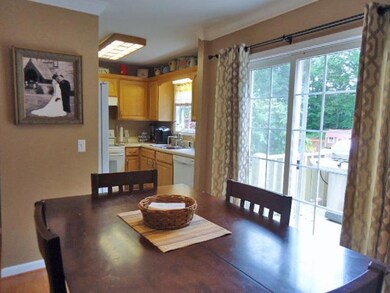 This is the dining/kitchen area. Sliding door unit gives great natural lighting to this space.