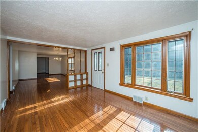 The 16x11 living room features a large picture win