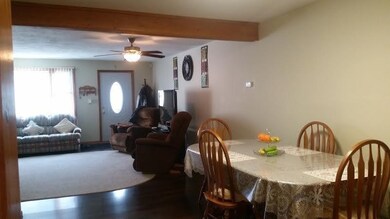 View from kitchen through dining room and into living room.