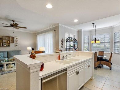 Living area with arched walkways, light tile patte
