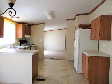 View of kitchen looking out into the living area f